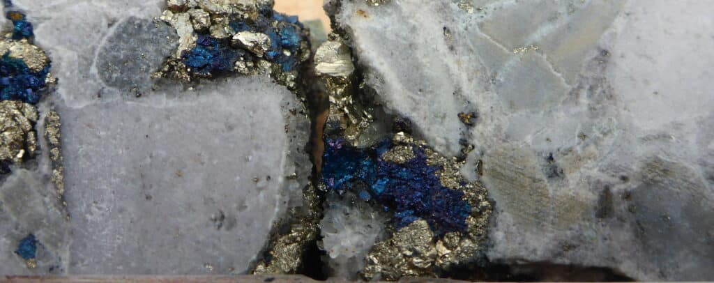 Home Nuton Antakori Ak 18 026 908 09m Drill Core Showing Bornite And Chalcopyrite 1024x406